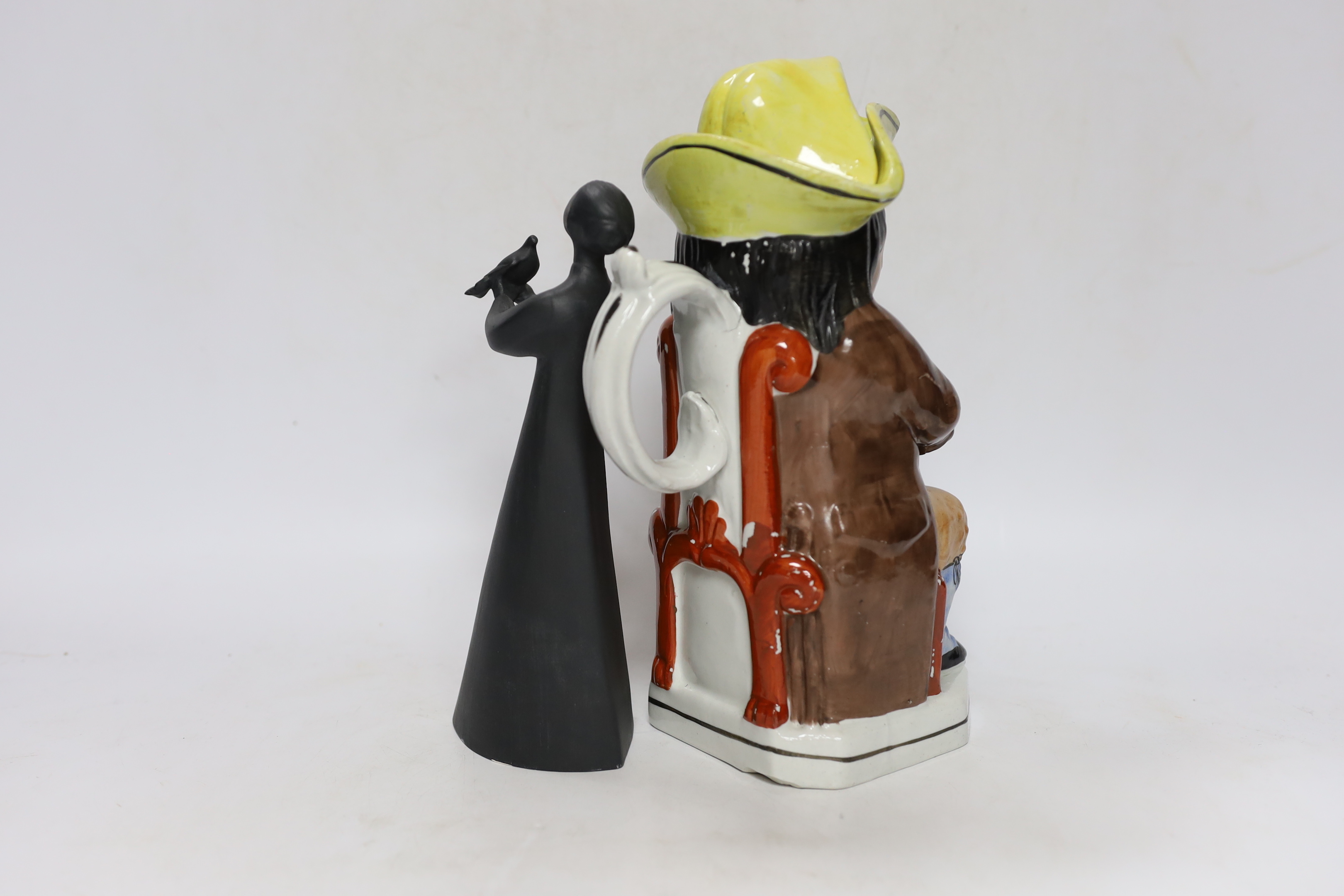 A Royal Doulton figurine 'Peace' and a Doulton style Toby jug, largest 26cm high